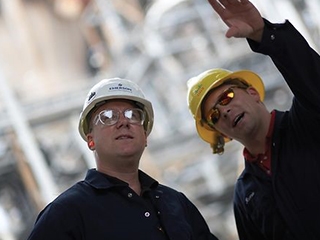 Two men with Emerson hard hats