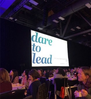 Monitor that reads: "dare to lead"